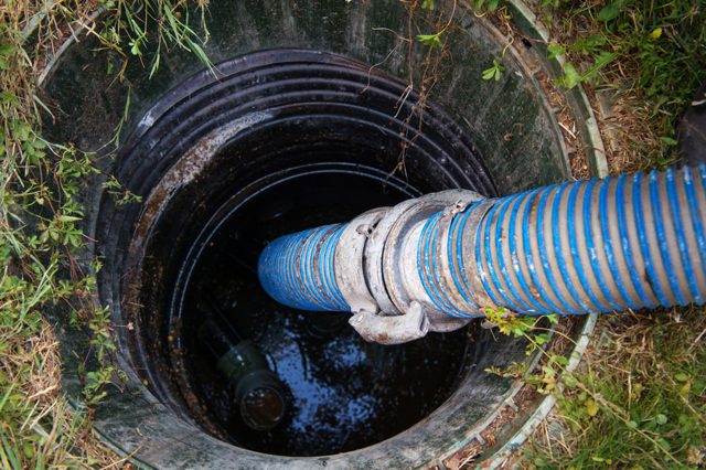 Stock photo of a septic tank riser and lid